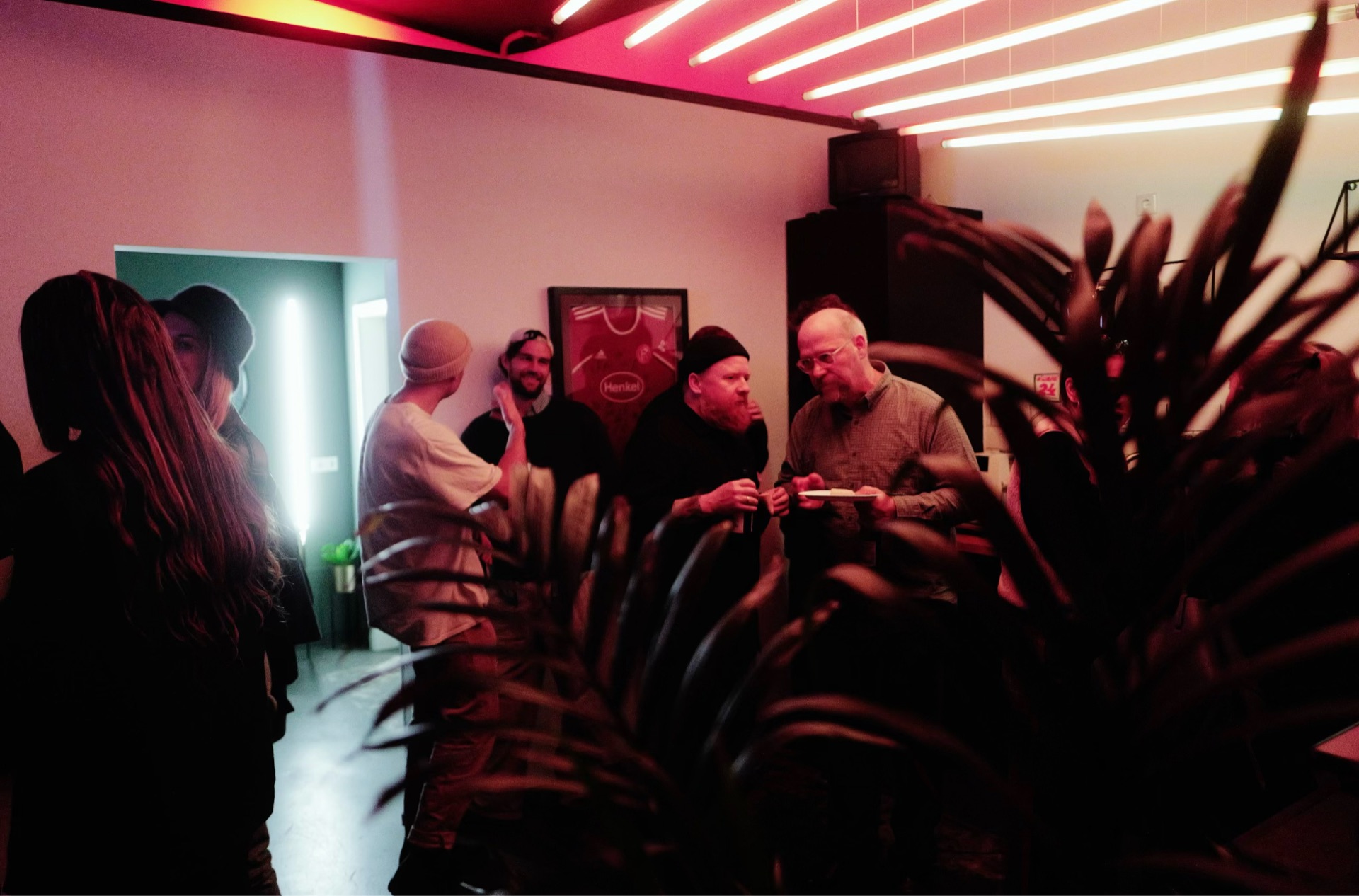 WHAT THE FILM 2024 — guests in conversation under red light